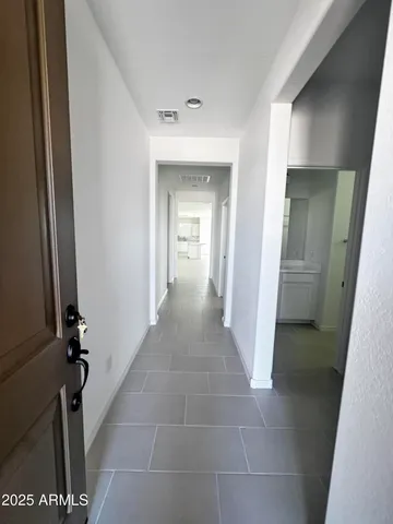 a large kitchen with stainless steel appliances kitchen island a refrigerator sink and cabinets