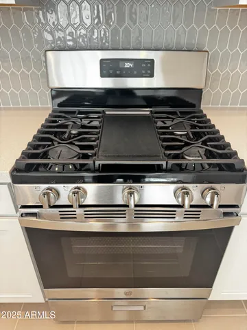 a kitchen with a sink and a window