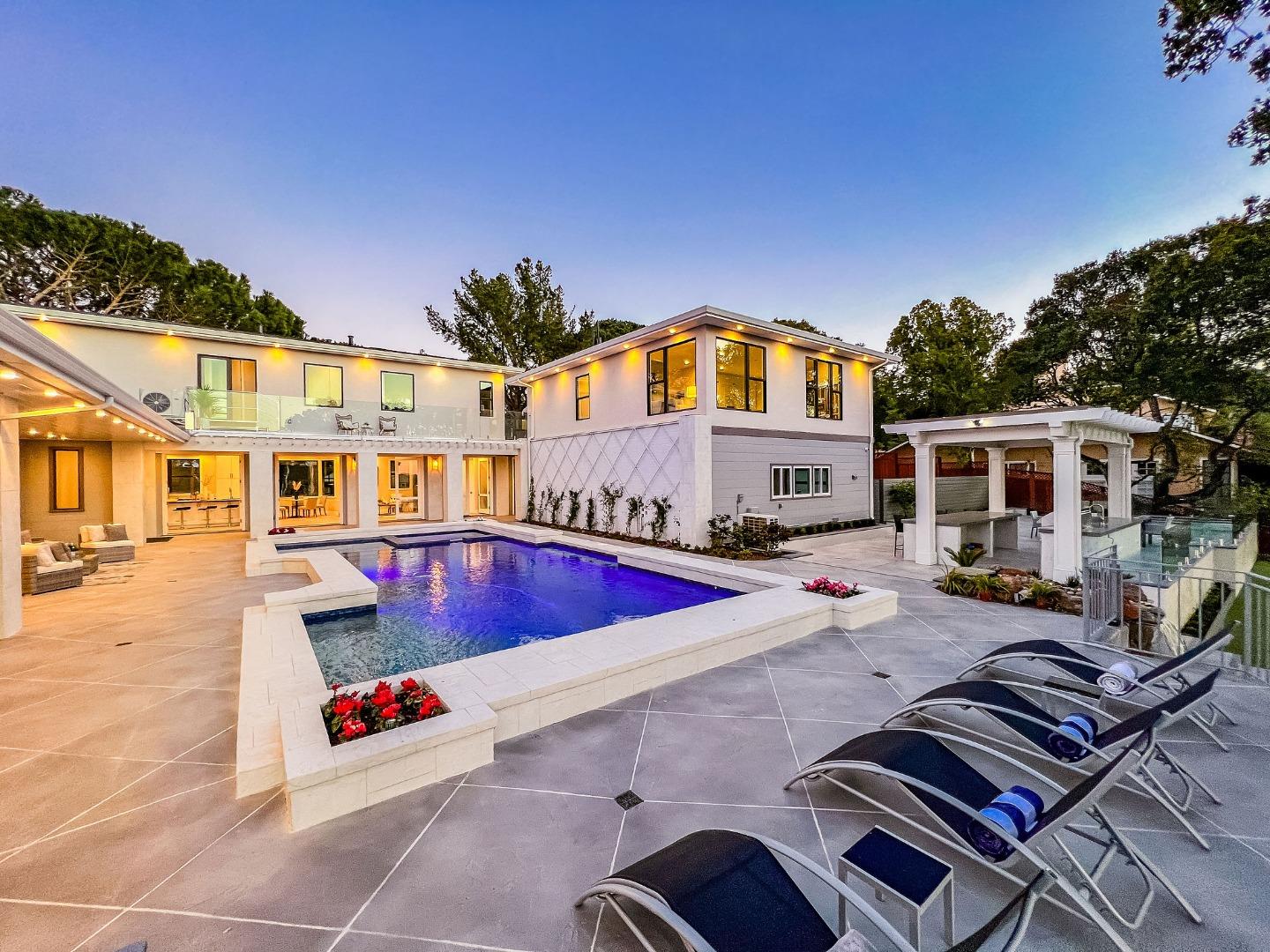 245 Eucalyptus Avenue Hillsborough, CA 94010 - Photo 1 of 27 a view of a patio with swimming pool table and chairs