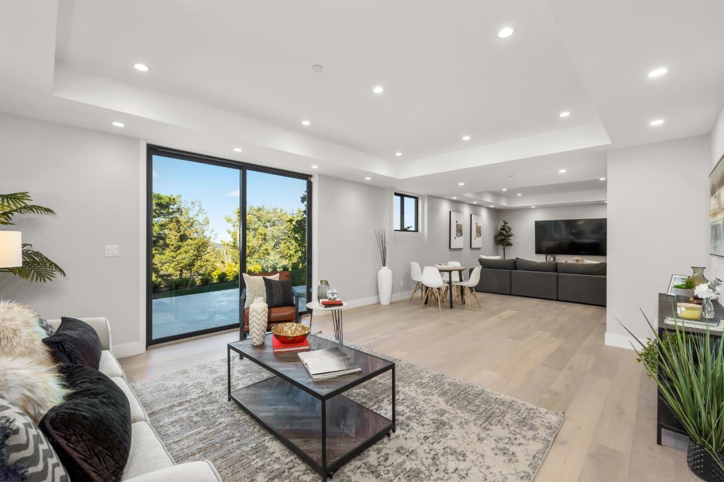 245 Eucalyptus Avenue Hillsborough, CA 94010 - Photo 16 of 27 a living room with furniture and a large window