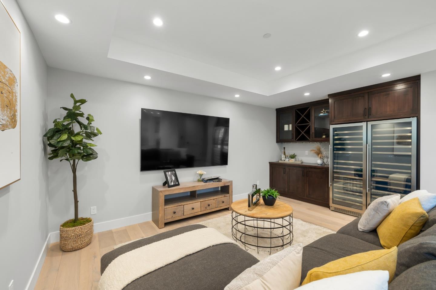 245 Eucalyptus Avenue Hillsborough, CA 94010 - Photo 18 of 27 a living room with furniture and a flat screen tv