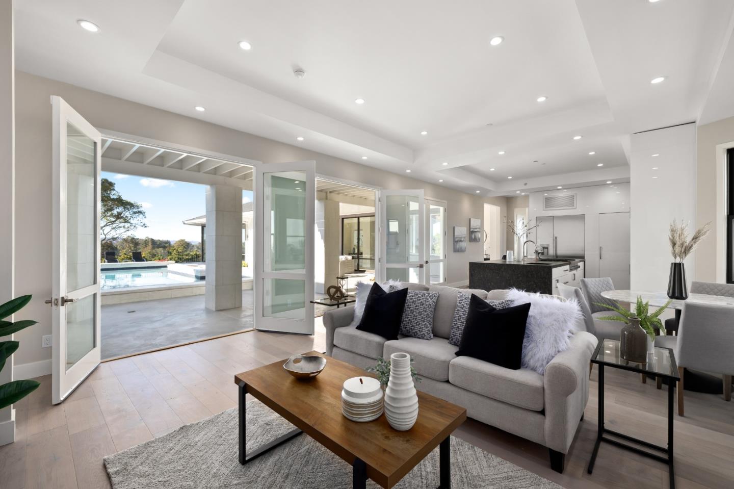 245 Eucalyptus Avenue Hillsborough, CA 94010 - Photo 7 of 27 a living room with furniture and a large window
