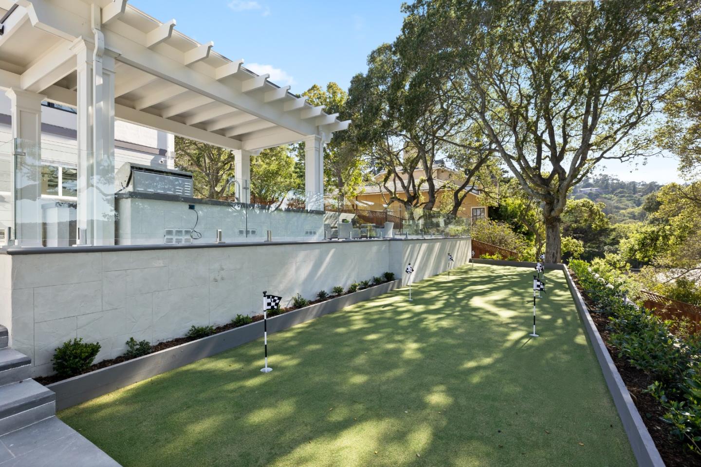 245 Eucalyptus Avenue Hillsborough, CA 94010 - Photo 10 of 27 a backyard of a house with lots of green space