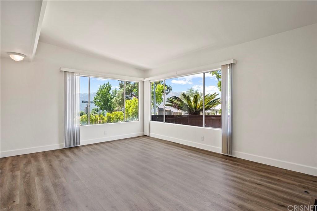 3653 El Caminito La Crescenta, CA 91214 - Photo 22 of 75 an empty room with wooden floor and windows