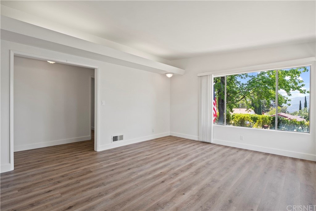 3653 El Caminito La Crescenta, CA 91214 - Photo 23 of 75 a view of an empty room with wooden floor and a window