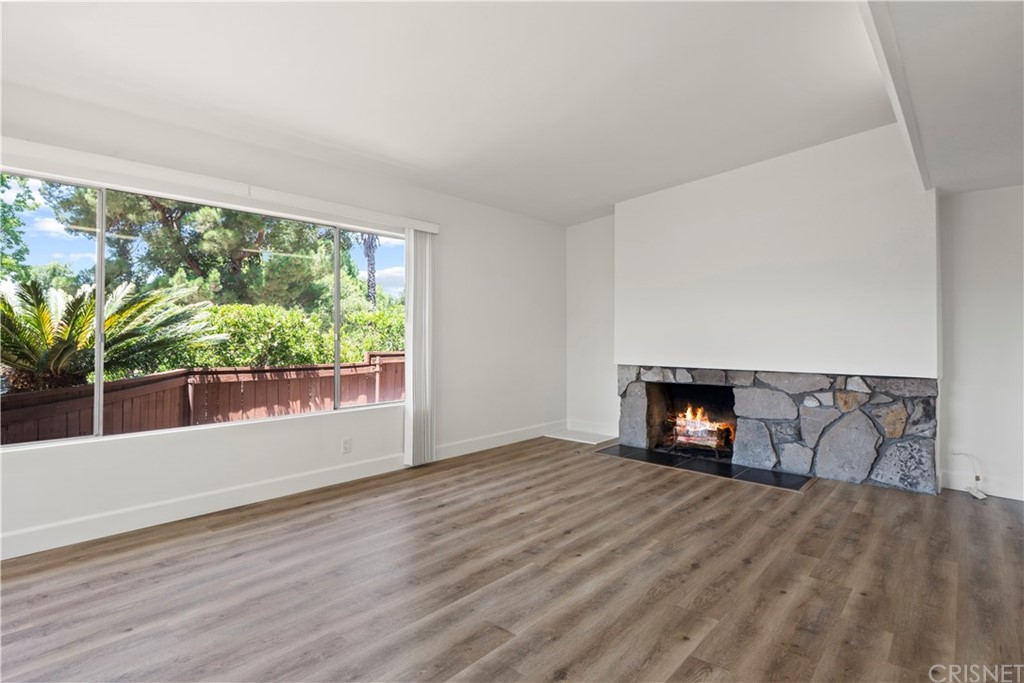 3653 El Caminito La Crescenta, CA 91214 - Photo 25 of 75 a view of empty room with wooden floor and fireplace