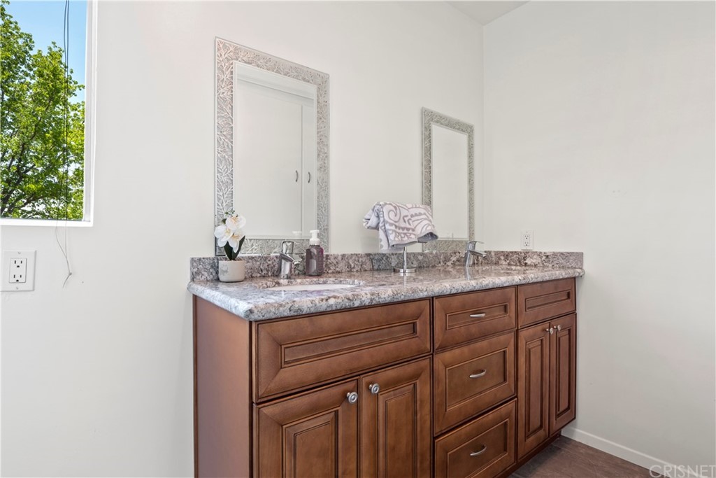 3653 El Caminito La Crescenta, CA 91214 - Photo 49 of 75 a bathroom with a granite countertop sink and a mirror
