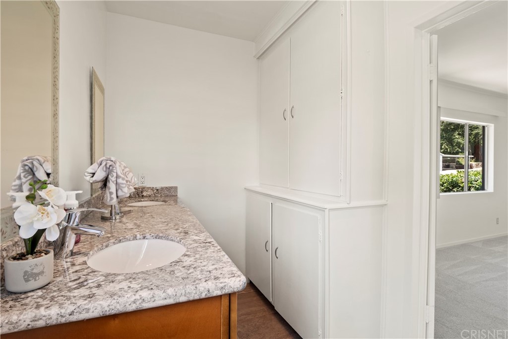 3653 El Caminito La Crescenta, CA 91214 - Photo 50 of 75 a bathroom with a granite countertop sink and a mirror