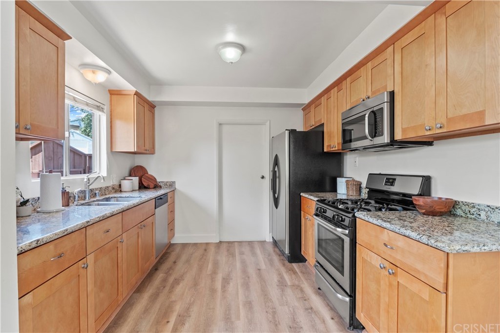 3653 El Caminito La Crescenta, CA 91214 - Photo 6 of 75 a kitchen with stainless steel appliances granite countertop a stove a sink dishwasher and a refrigerator