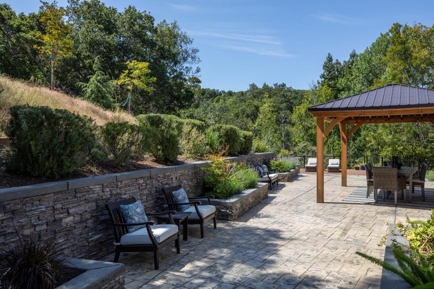 345 Harcross Road Woodside, CA 94062 - Photo 25 of 37 a view of a backyard with sitting area and garden