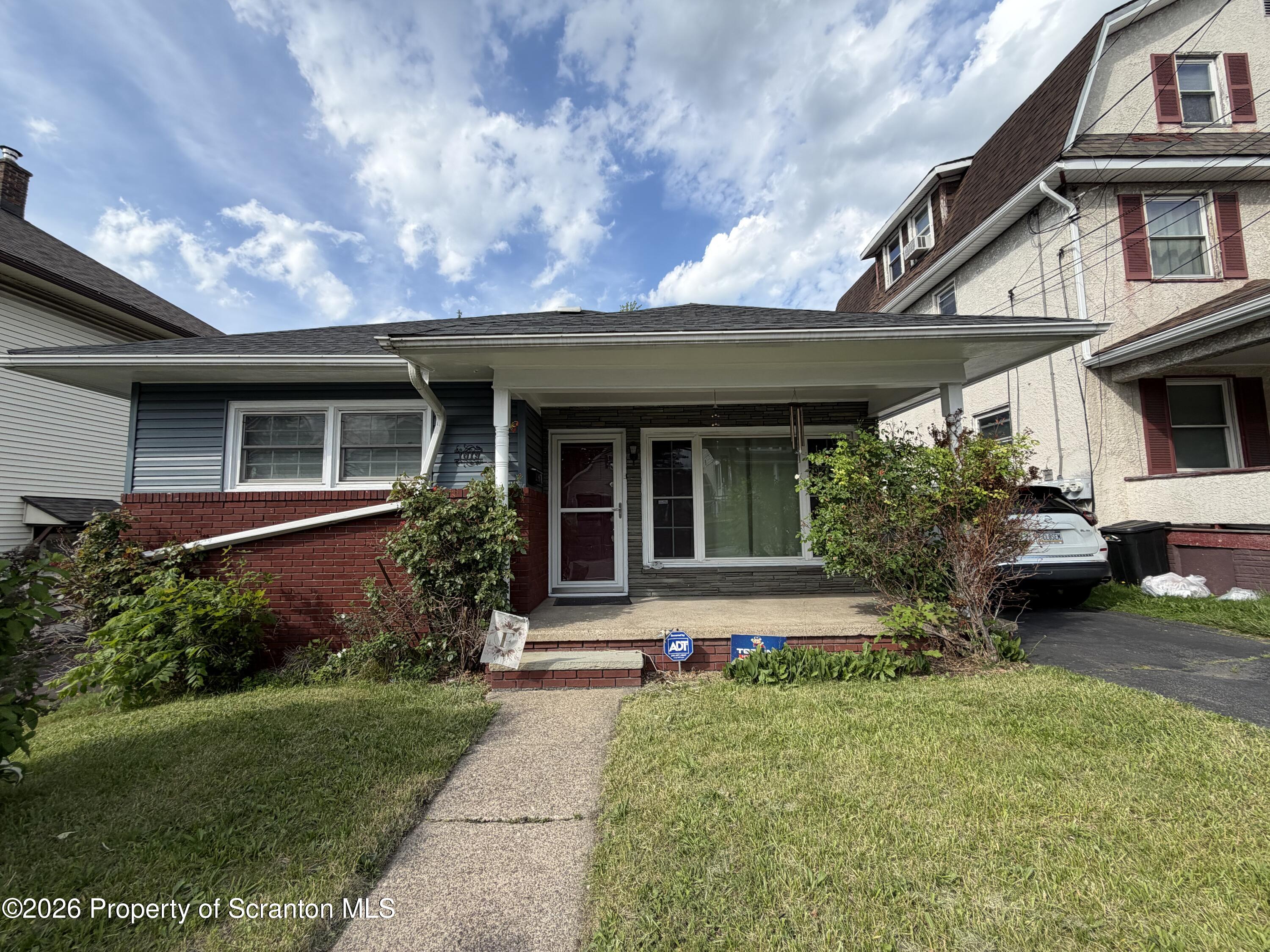 1019 Moosic Street Scranton, PA 18505 - Photo 2 of 43 a front view of a house with garden and porch