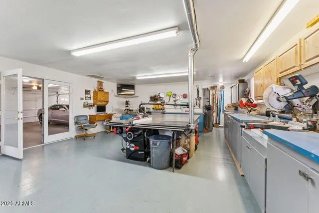 a view of a dining room with furniture a chandelier and wooden floor