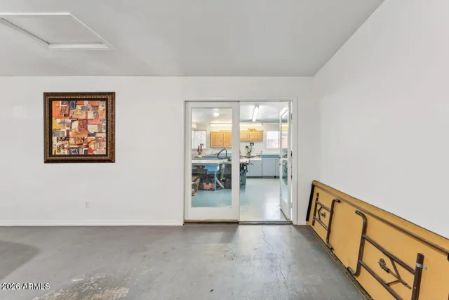 a kitchen with stainless steel appliances kitchen island granite countertop a refrigerator and a stove