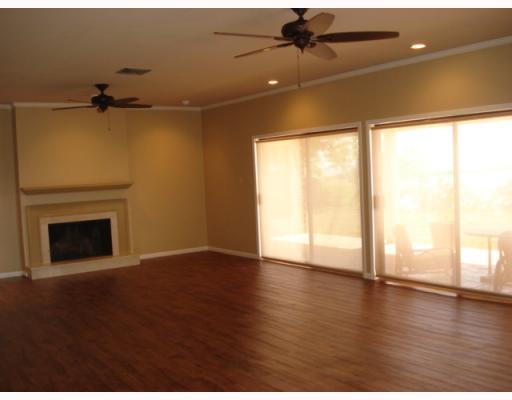 335 Bay View Boulevard Portland, TX 78374 - Photo 2 of 4 a view of an empty room with a window and wooden floor