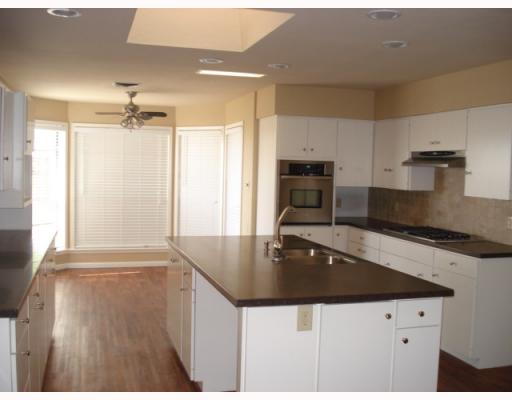 335 Bay View Boulevard Portland, TX 78374 - Photo 3 of 4 a kitchen with granite countertop a sink a stove and cabinets