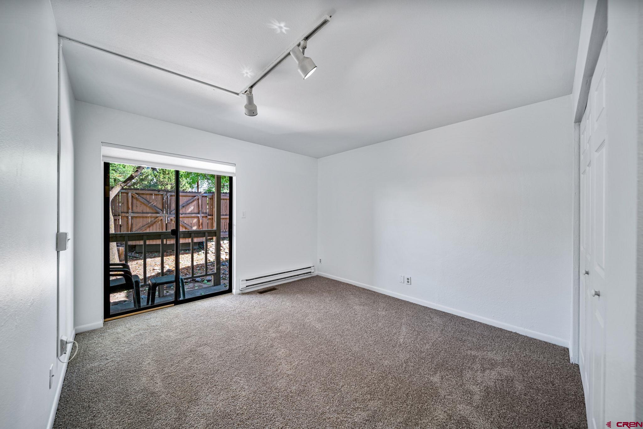 1200 Florida Road, Unit 11 Durango, CO 81301 - Photo 11 of 19 an empty room with glass door