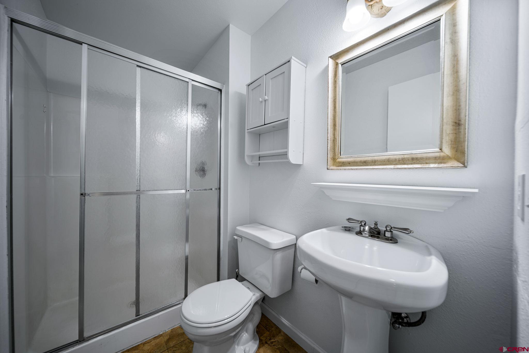 1200 Florida Road, Unit 11 Durango, CO 81301 - Photo 12 of 19 a bathroom with a sink toilet and shower