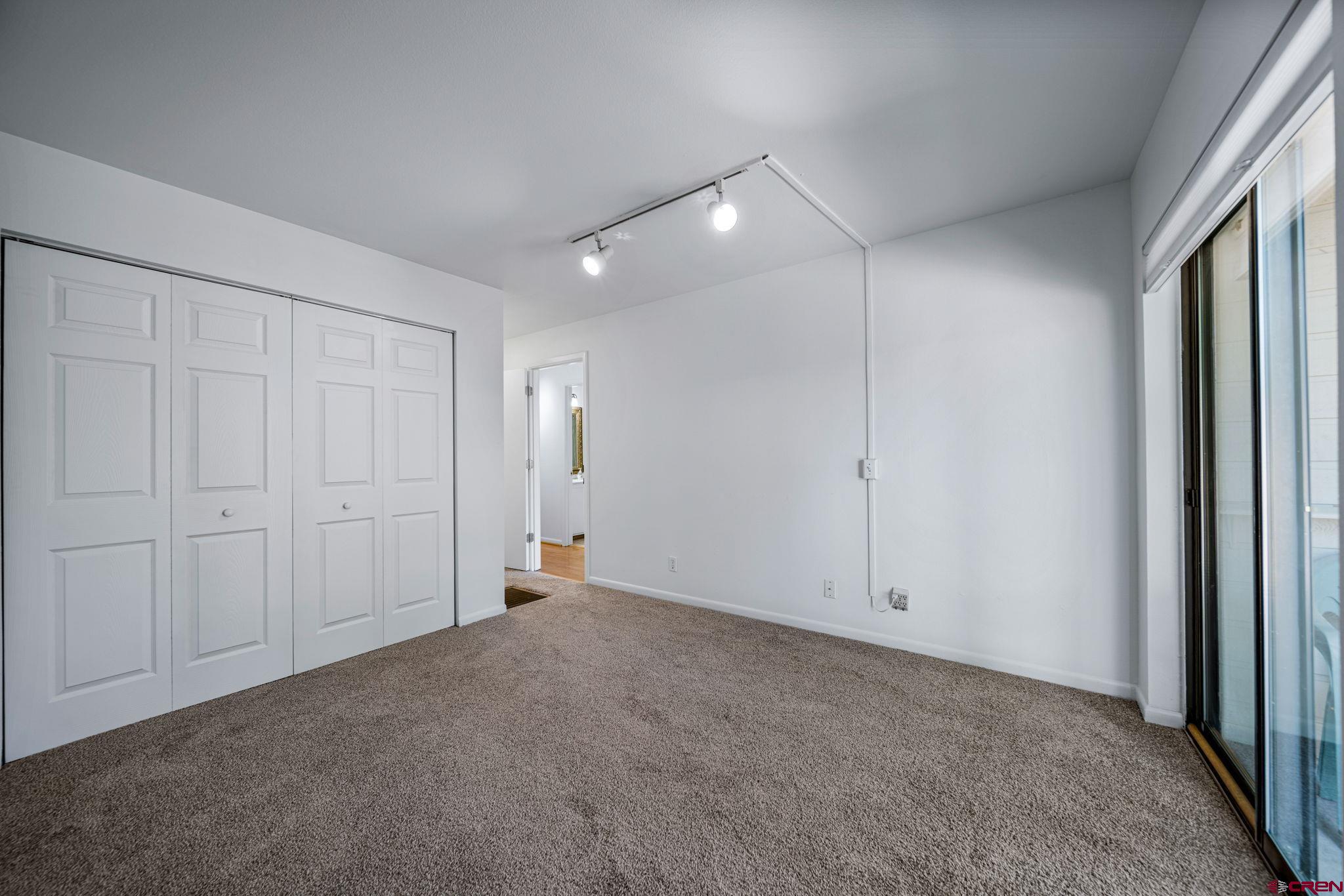 1200 Florida Road, Unit 11 Durango, CO 81301 - Photo 13 of 19 an empty room with fan & windows