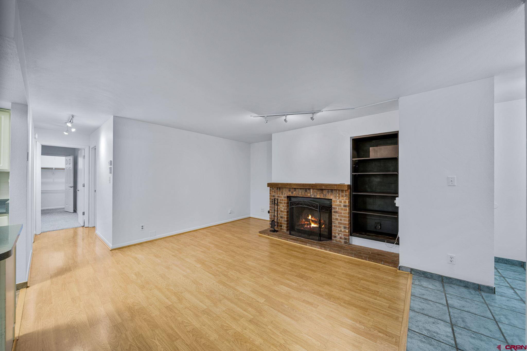 1200 Florida Road, Unit 11 Durango, CO 81301 - Photo 18 of 19 a view of empty room with a fireplace and cabinet
