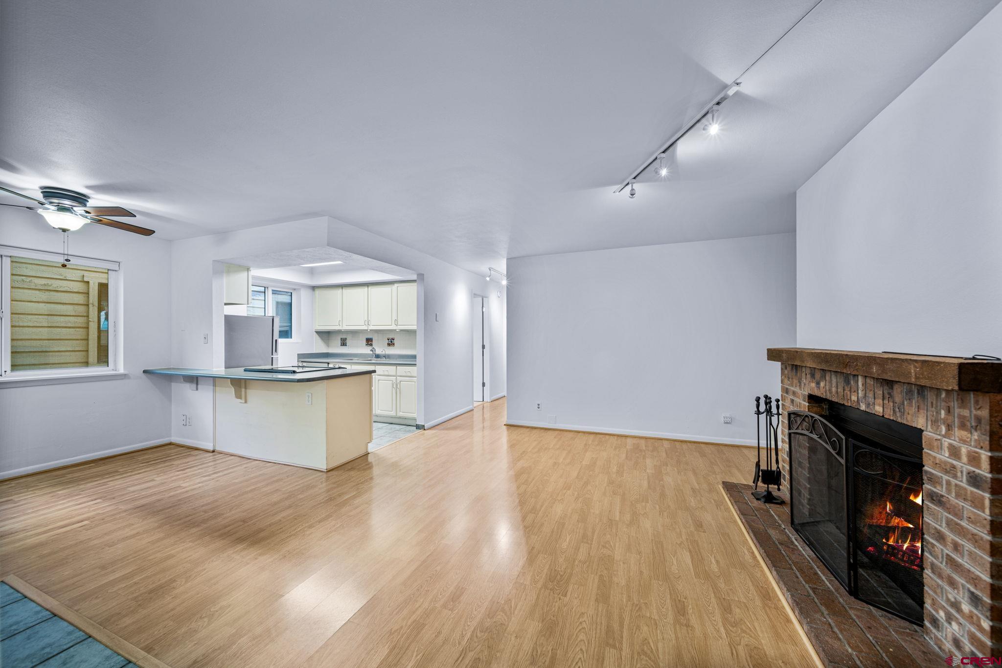 1200 Florida Road, Unit 11 Durango, CO 81301 - Photo 4 of 19 a view of kitchen with cabinets and wooden floor