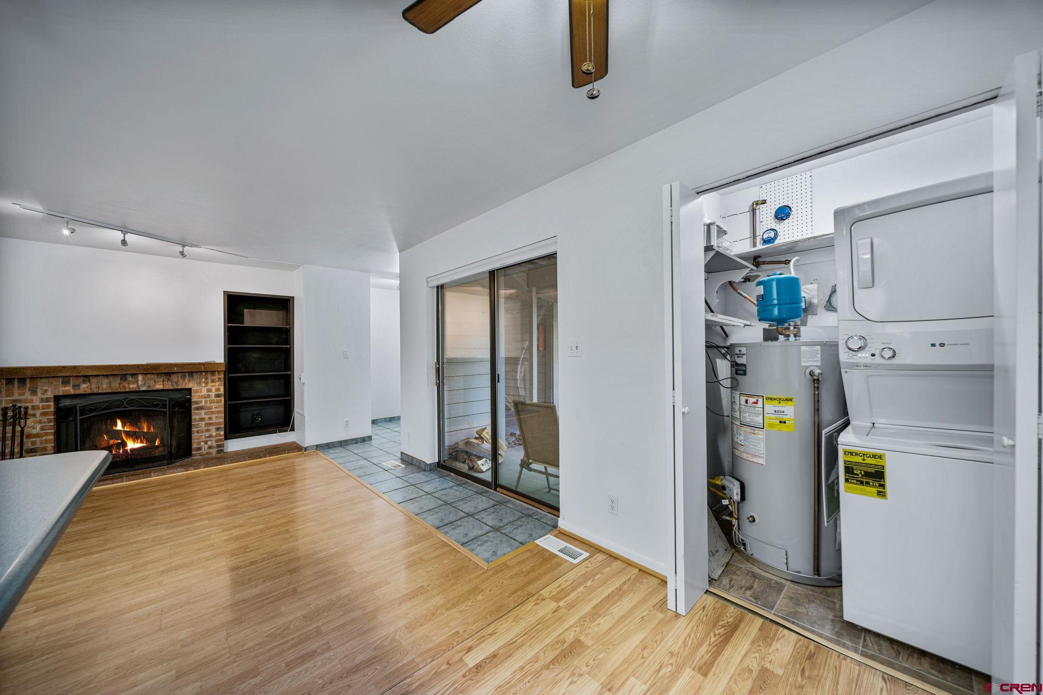 1200 Florida Road, Unit 11 Durango, CO 81301 - Photo 5 of 19 a view of empty room with fireplace and wooden floor