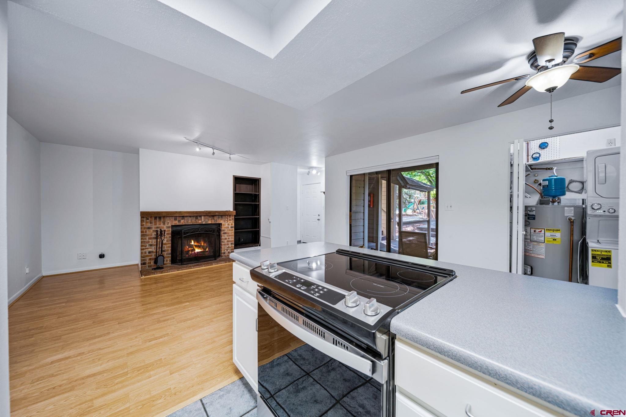 1200 Florida Road, Unit 11 Durango, CO 81301 - Photo 8 of 19 a kitchen with a stove and a fireplace