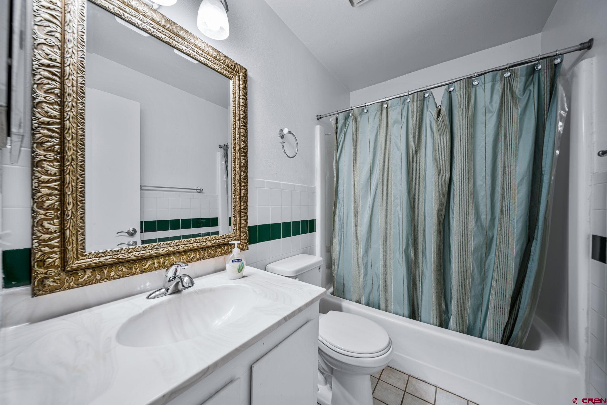 1200 Florida Road, Unit 11 Durango, CO 81301 - Photo 9 of 19 a bathroom with a sink toilet and shower