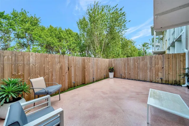 a view of a balcony with wooden floor and stairs