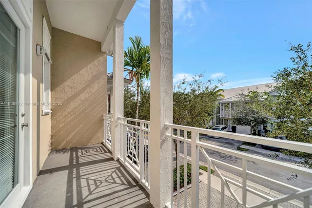 an aerial view of a house with outdoor space and lake view