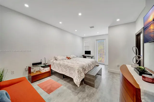 an aerial view of a house with a garden and plants