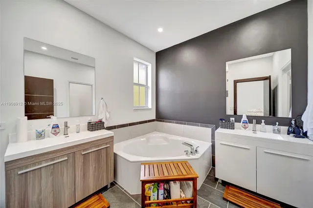 an aerial view of a residential houses with outdoor space