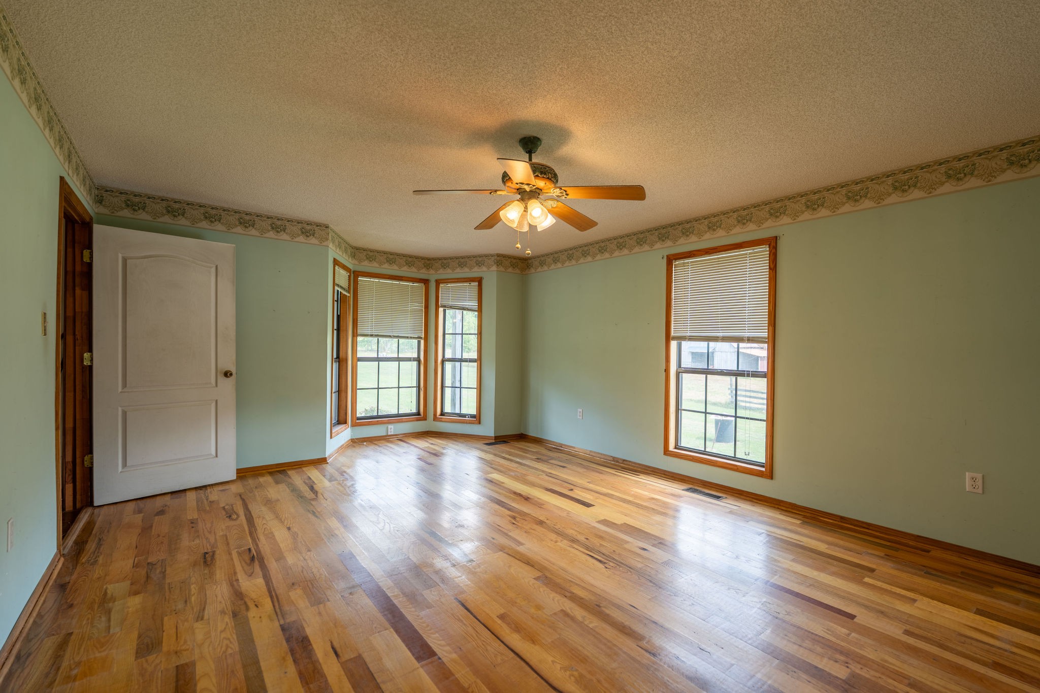 1919 Bear Creek Road Collinwood, TN 38450 - Photo 14 of 29 a view of an empty room with window and wooden floor