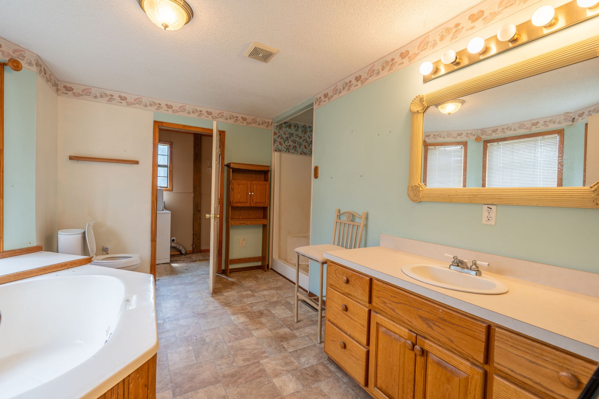 1919 Bear Creek Road Collinwood, TN 38450 - Photo 16 of 29 a spacious bathroom with a tub sink and mirror