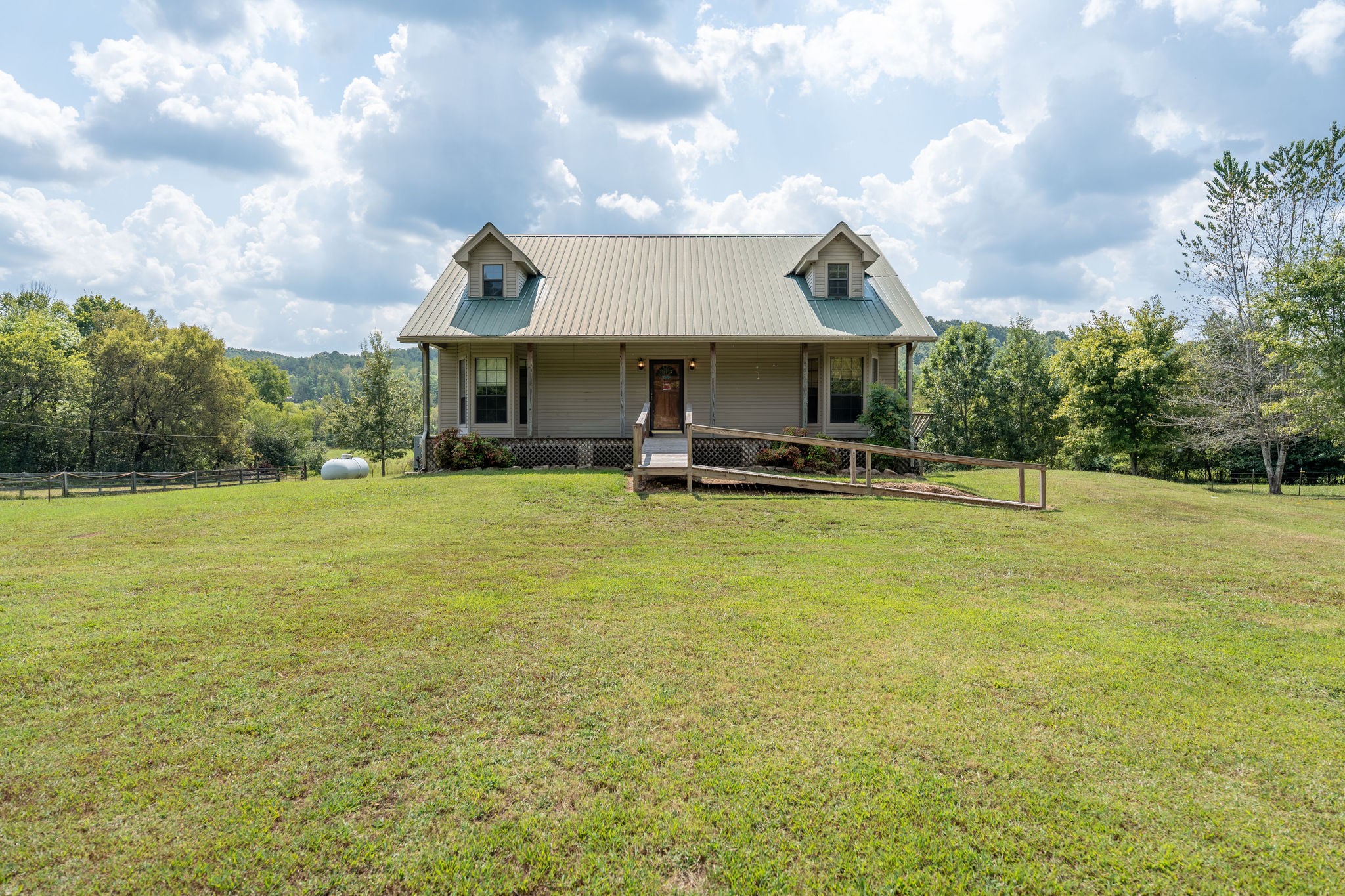 1919 Bear Creek Road Collinwood, TN 38450 - Photo 2 of 29 a swimming pool with outdoor seating and yard