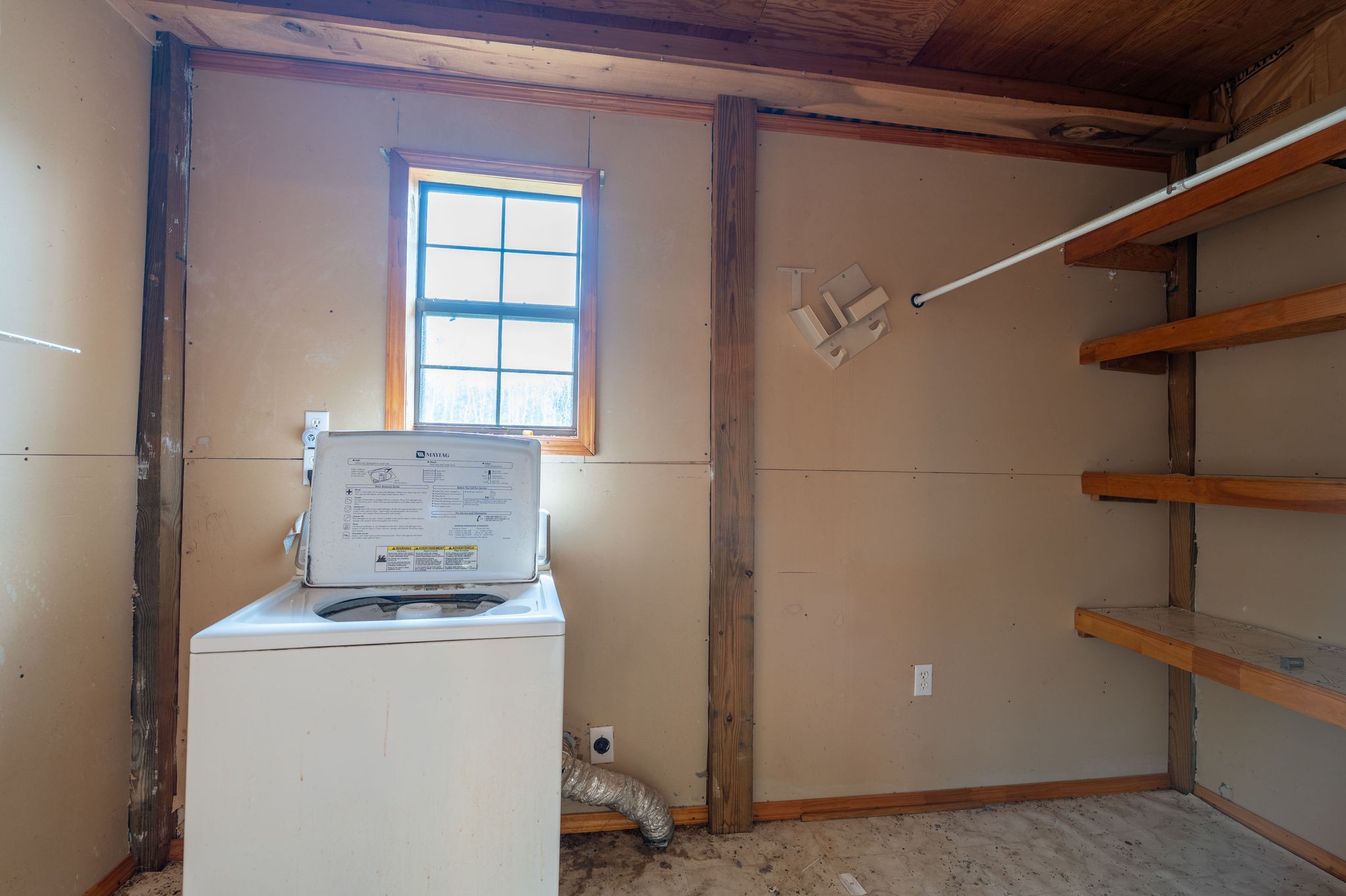 1919 Bear Creek Road Collinwood, TN 38450 - Photo 22 of 29 a room with a refrigerator and window