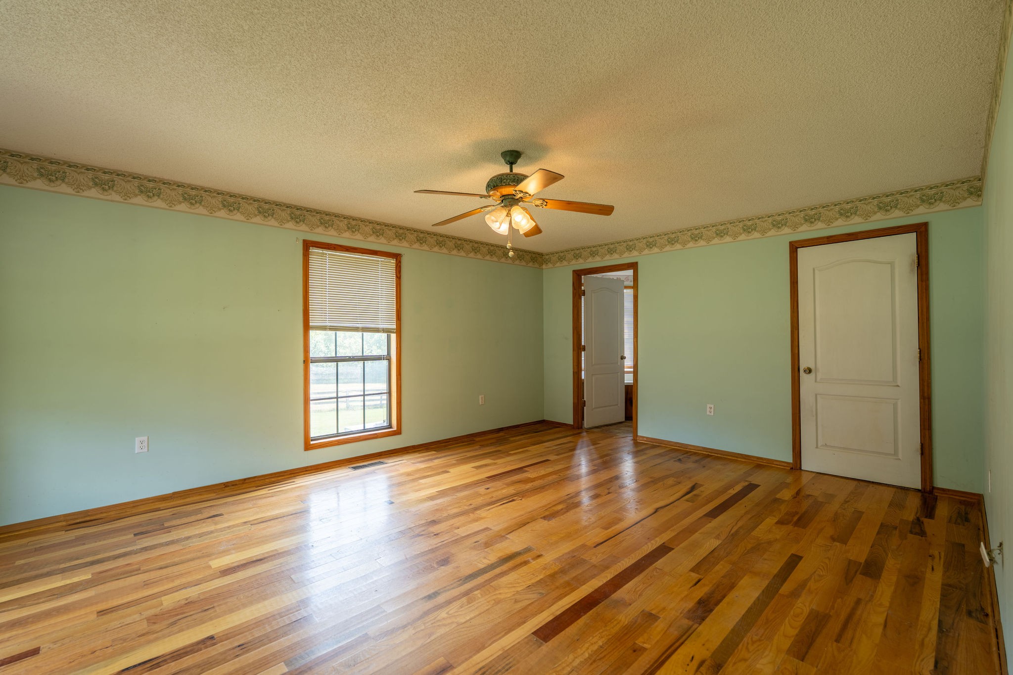 1919 Bear Creek Road Collinwood, TN 38450 - Photo 24 of 29 a view of an empty room with window and wooden floor
