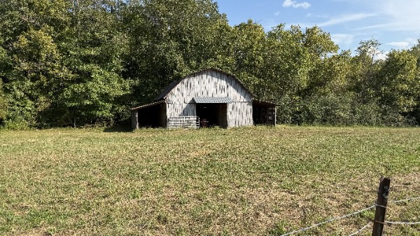 1919 Bear Creek Road Collinwood, TN 38450 - Photo 25 of 29 a front view of a house with large trees