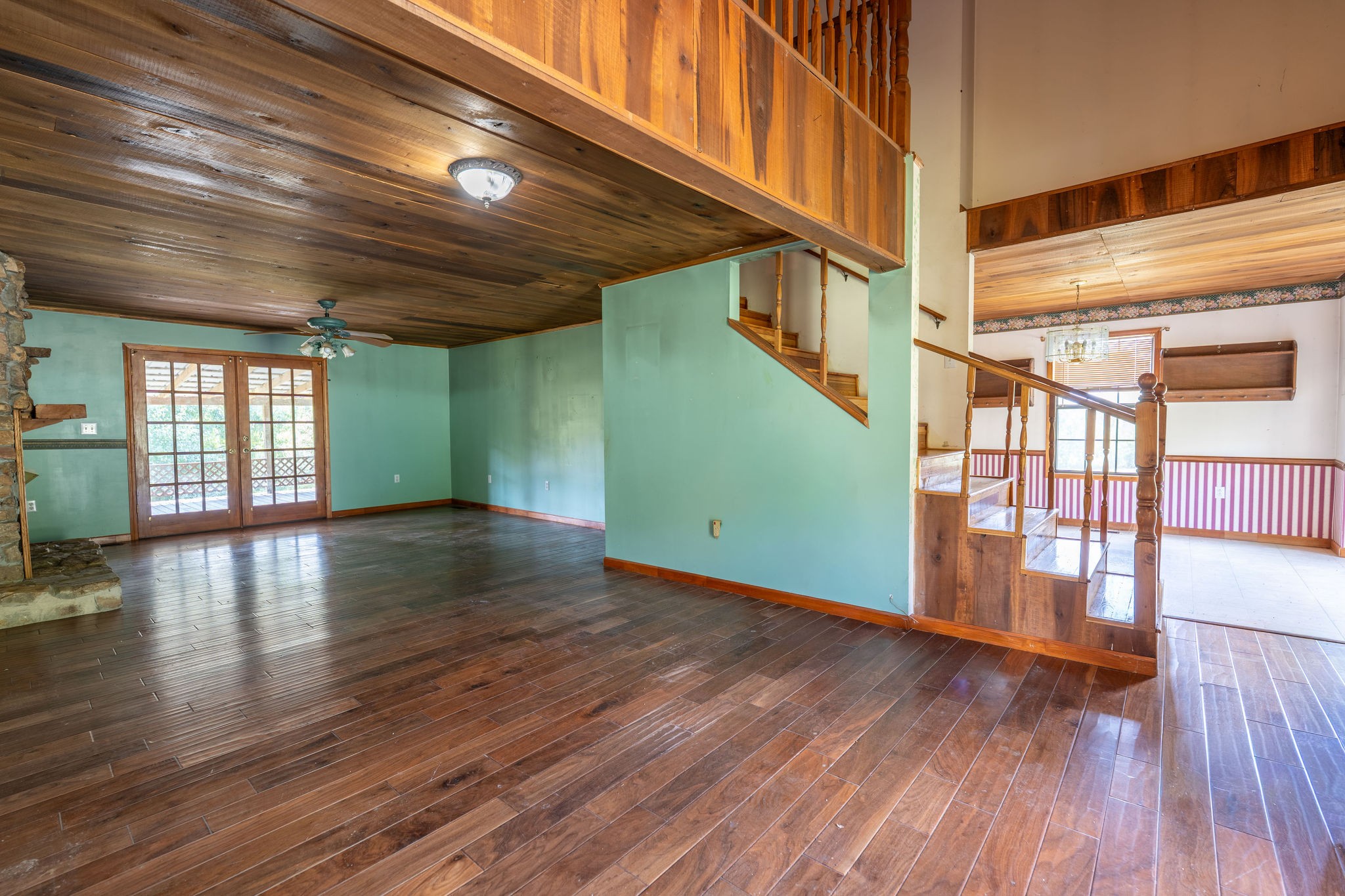 1919 Bear Creek Road Collinwood, TN 38450 - Photo 6 of 29 a view of an empty room with wooden floor and a window