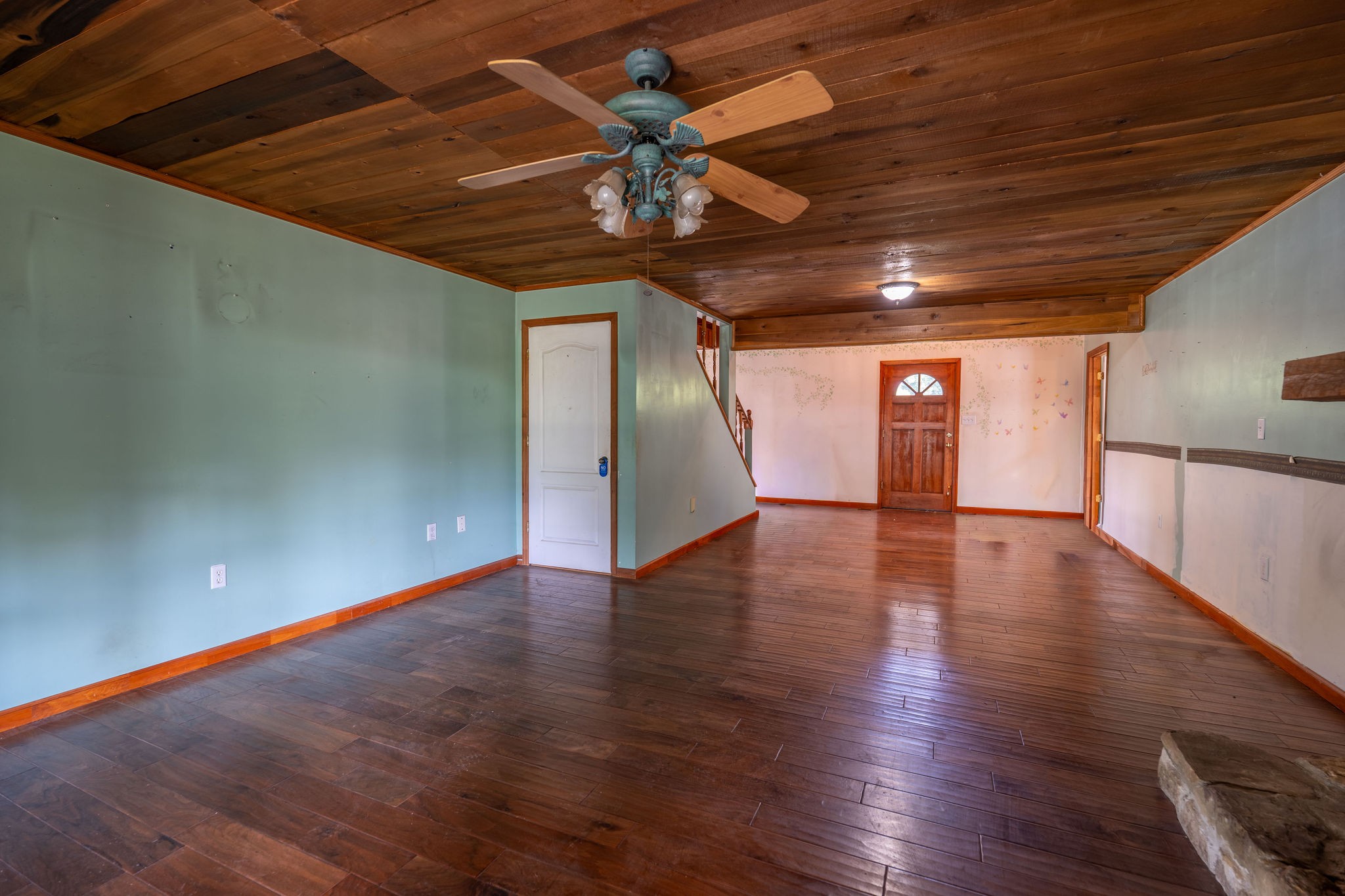 1919 Bear Creek Road Collinwood, TN 38450 - Photo 8 of 29 a view of a livingroom with wooden floor and a ceiling fan