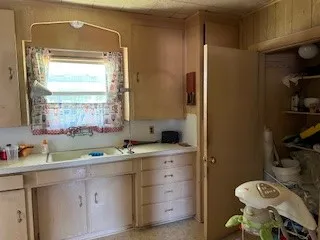 a bathroom with a sink toilet and mirror
