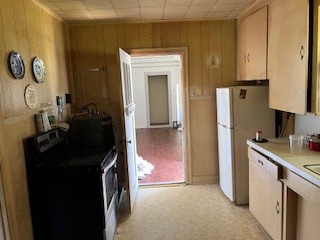 1217 East 27th Street Bryan, TX 77803 - Photo 17 of 27 a kitchen with a refrigerator and a stove
