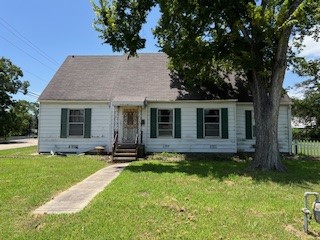 1217 East 27th Street Bryan, TX 77803 - Photo 2 of 27 a front view of a house with a garden
