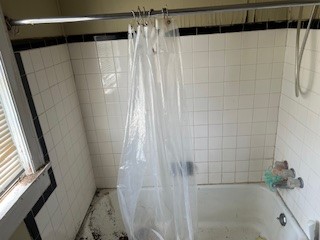 1217 East 27th Street Bryan, TX 77803 - Photo 22 of 27 a bathroom with a shower and a tub