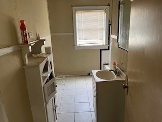 1217 East 27th Street Bryan, TX 77803 - Photo 23 of 27 a bathroom with a sink and a mirror