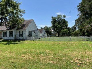 1217 East 27th Street Bryan, TX 77803 - Photo 6 of 27 a front view of a house with a yard