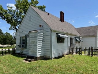 1217 East 27th Street Bryan, TX 77803 - Photo 9 of 27 a front view of a house with a yard