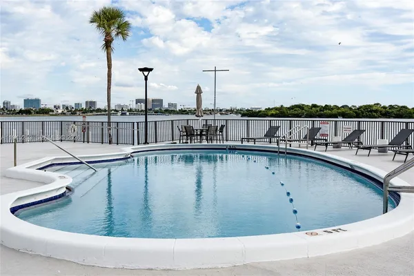 a view of a swimming pool with a lake view
