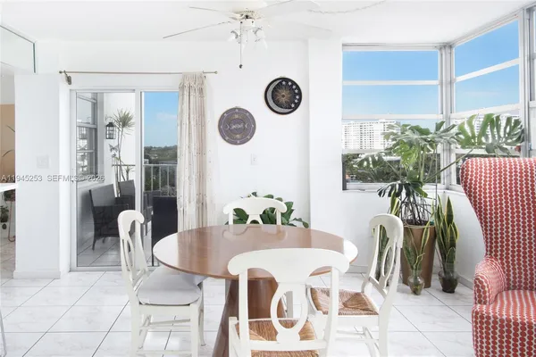 a view of a dining room with furniture and window