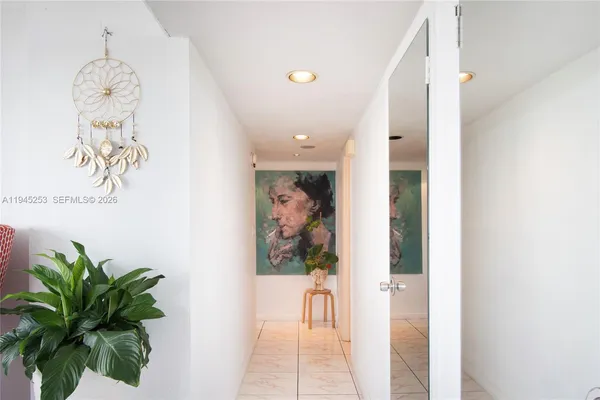 a picture of a hallway with wooden floor
