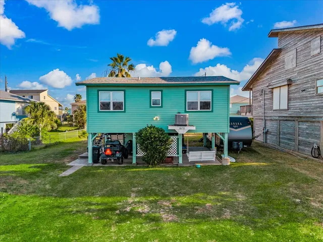a front view of house with yard and outdoor seating